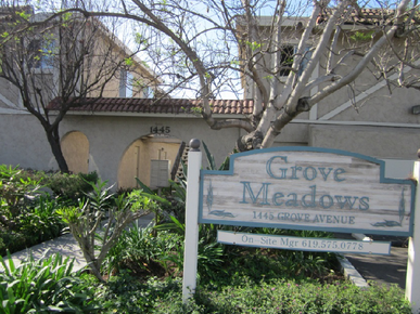 The front sign for the Grove Meadows Apartments at 1445 Grove Avenue