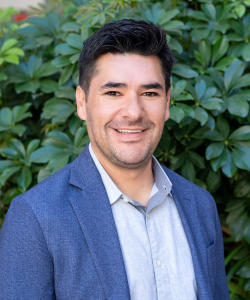 Our team member, Professional headshot of Ricardo Lopez, Multifamily Advisor and Apartment Consultant at ACI Apartments, wearing a suit and exuding a warm, professional demeanor.